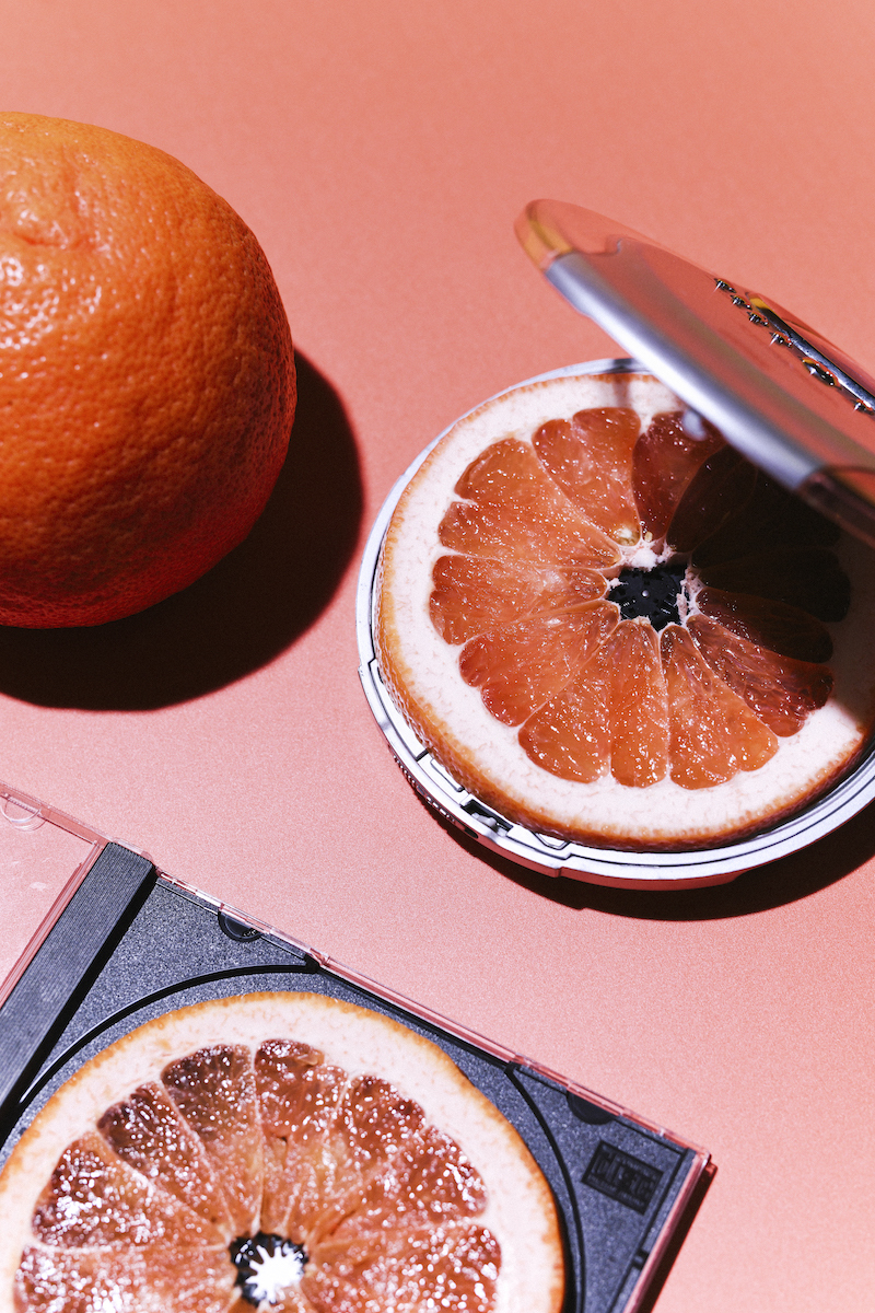 Grapefruit slices placed inside make-up foundation kit