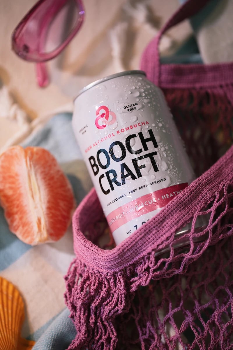 Booth Craft can next to a peeled grapefruit