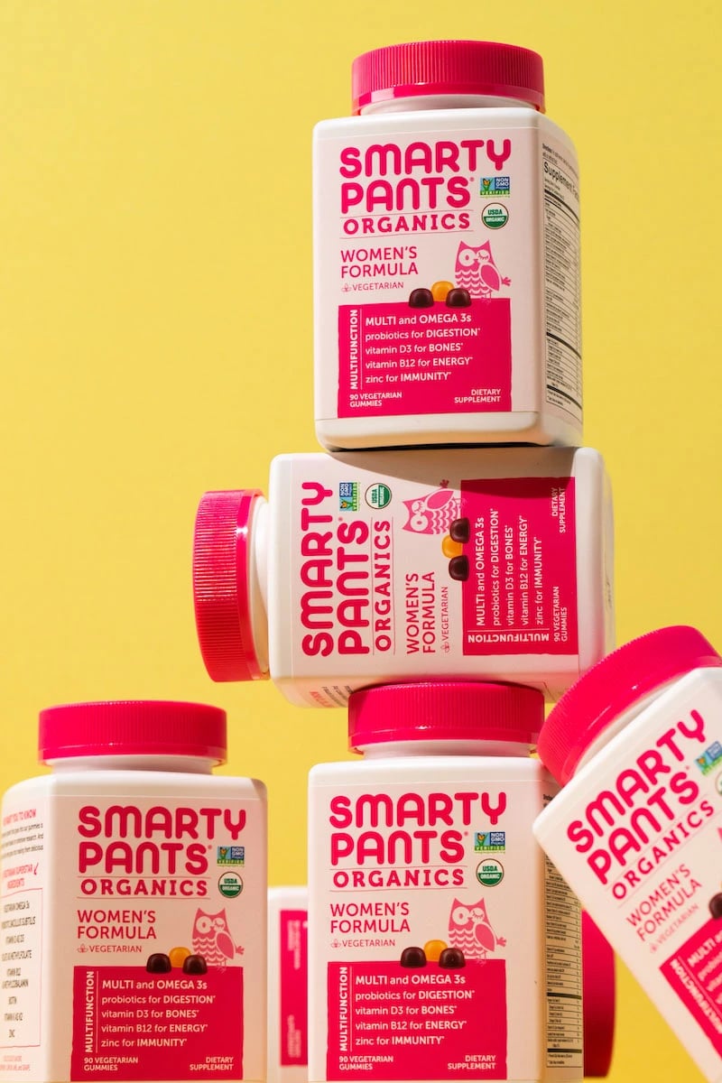 Stack of Smarty Pants women's formula supplement bottles